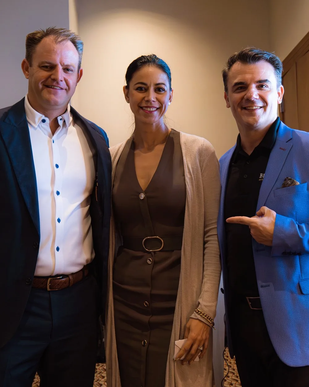 Rebekah Samples with two guests at a private event