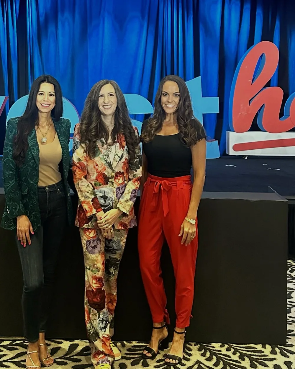 Rebekah Samples with two fellow leaders at an InvestHER event
