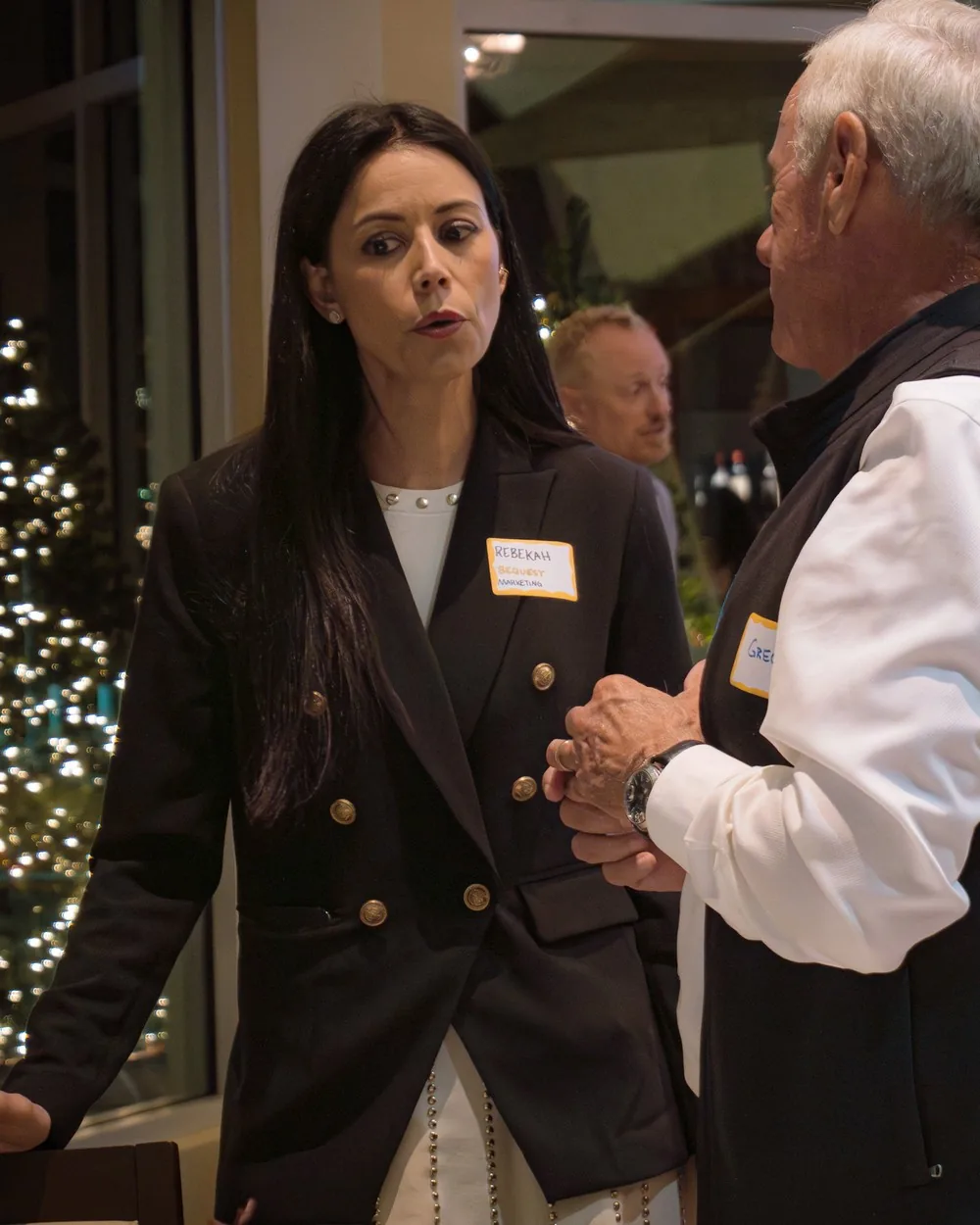 Rebekah Samples in conversation with a guest at a private dinner